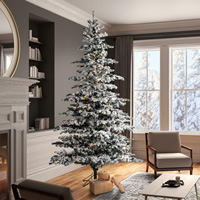 Flocked artificial Christmas tree with snow-covered branches and LED lights