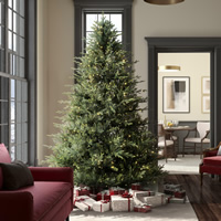 Traditional green artificial Christmas tree with warm white lights